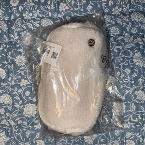 Brand new never opened lululemon white fuzzy belt bag